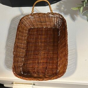 Hanging small wicker basket. Great as wall art or desk supplies. One handled